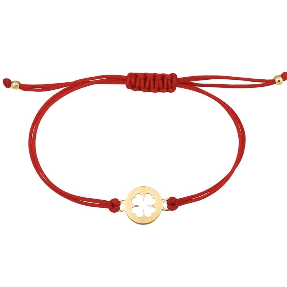 Гривна с червен конец и златна четирилистна детелина