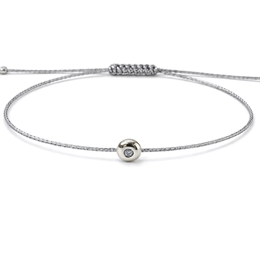 Гривна със сребрист конец и бяло злато с диамант